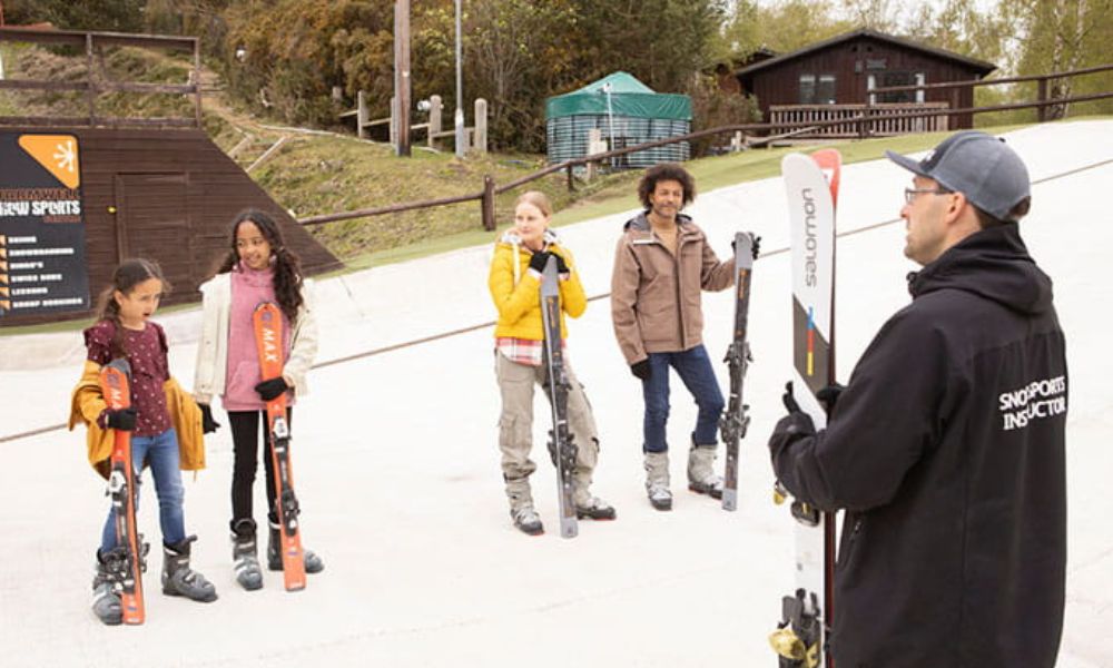 Ski lesson on the outdoor ski slope at Parkdean Warmwell.