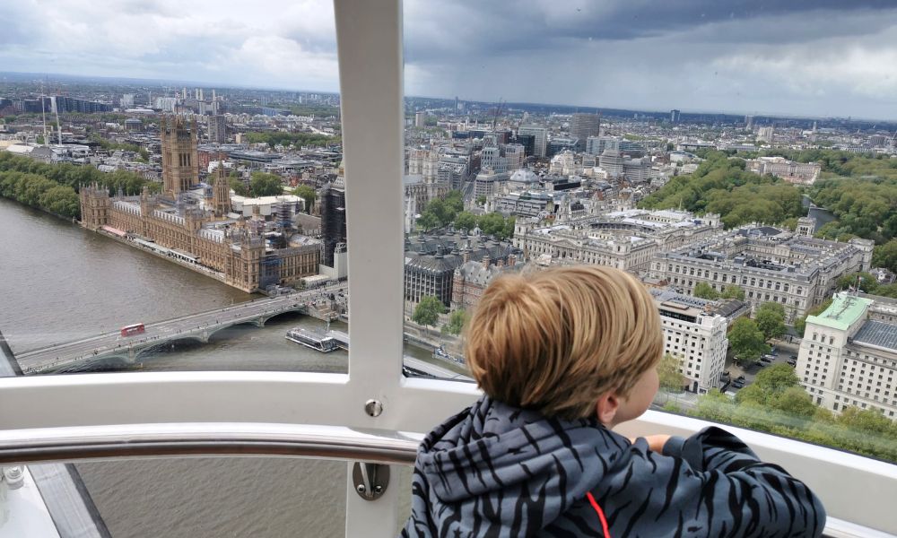 Child looking at the views of London from the London Eye.