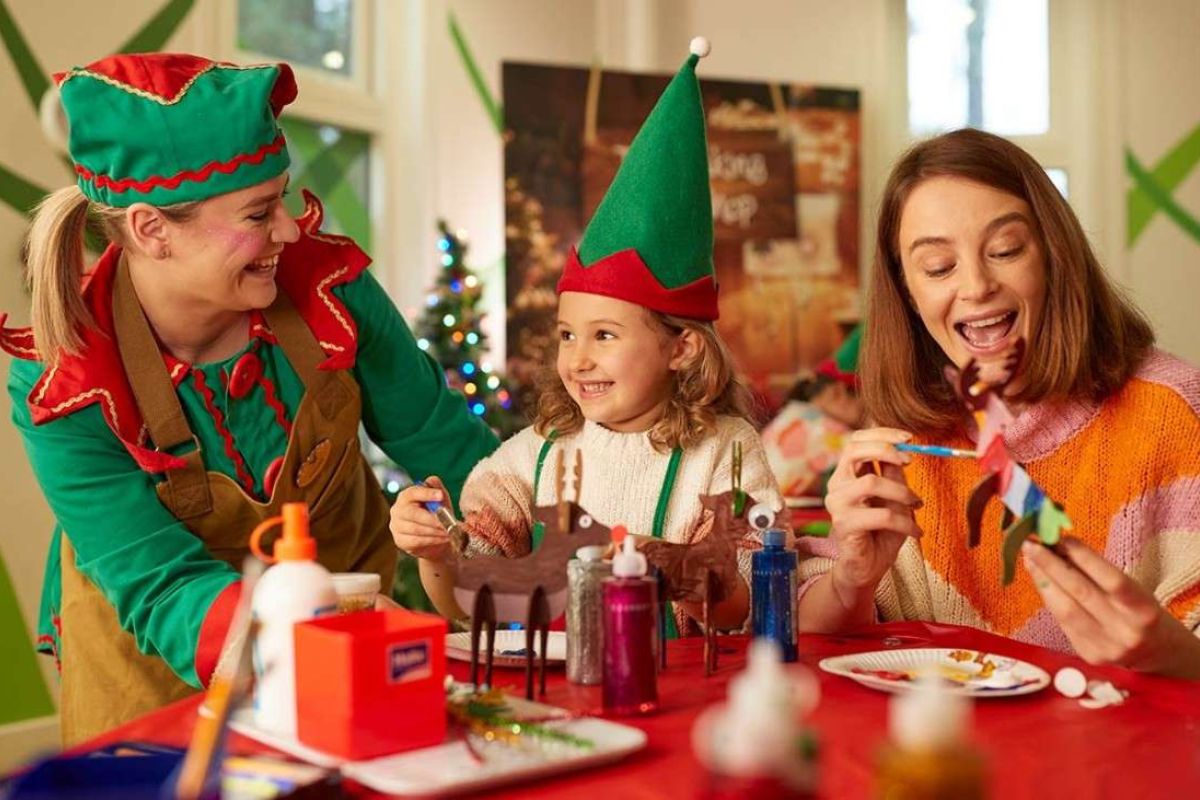 Child enjoying making Christmas crafts at the Elf Academy at Center Parcs - one of the best family Christmas breaks in the UK.