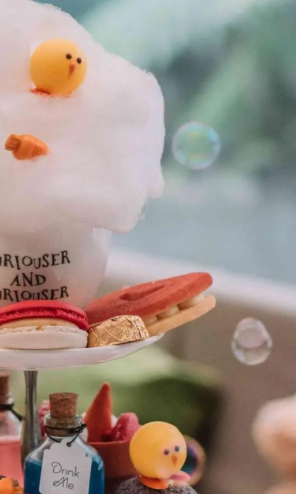 Alice in Wonderland themed afternoon tea for kids at the Sanderson Hotel in London including drink me potion, candy floss and macarons.