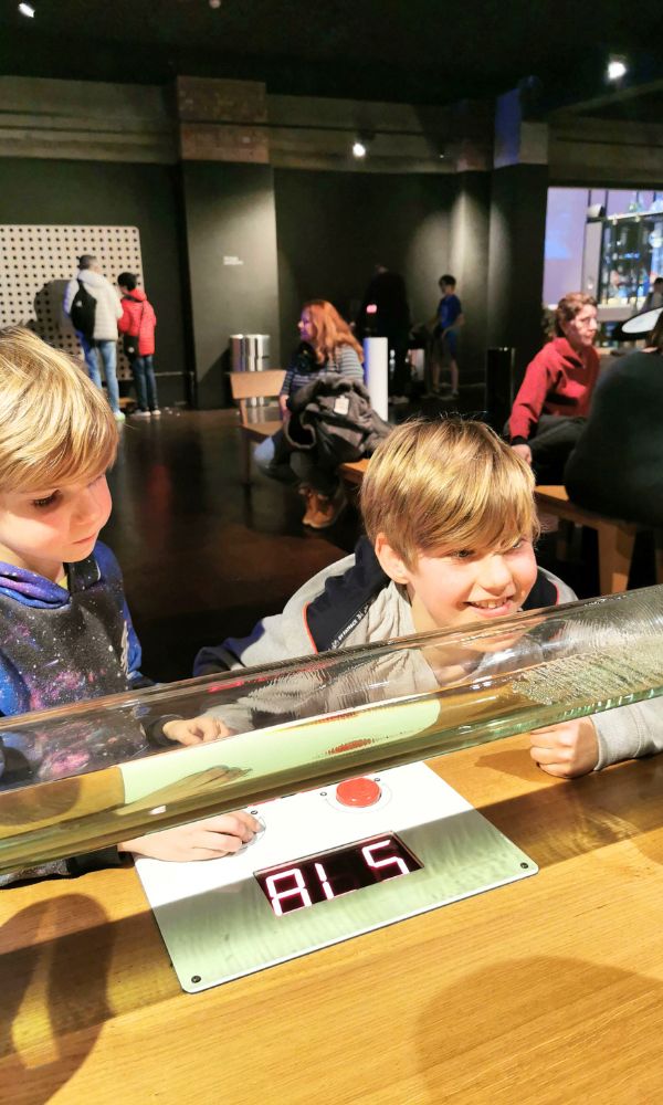 Kids looking at a science experiment at the Science Museum in London.