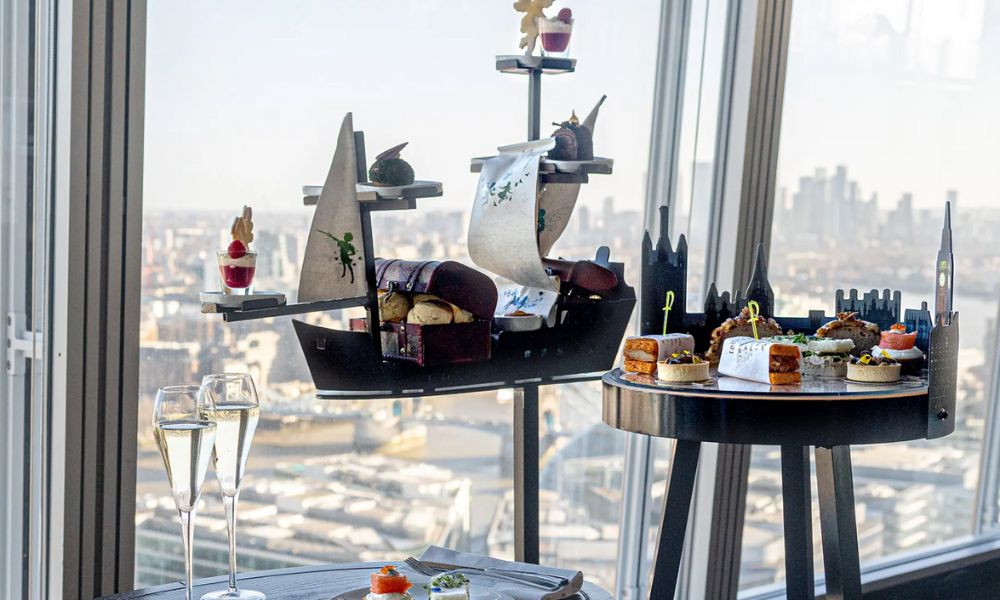 Peter Pan themed afternoon tea for kids in London at Aqua at the Shard with views of the London skyline in the background.